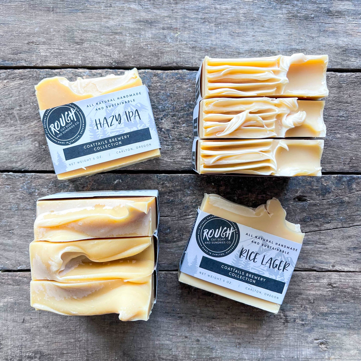 Our Beer Soap Collection stacked together on a wooden surface