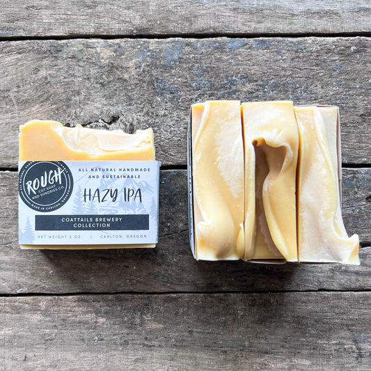 Bar of soap with a label on a wooden surface