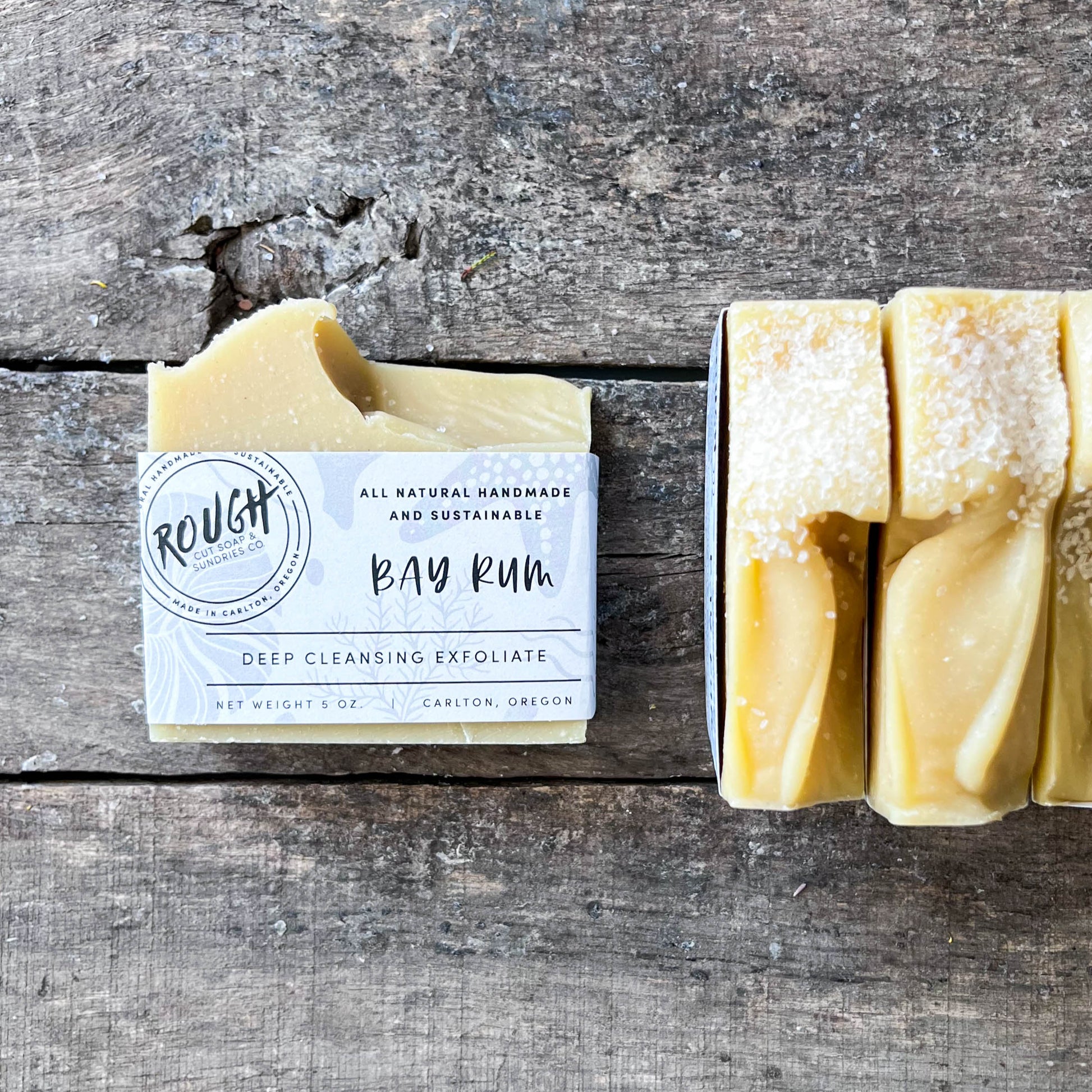 Bar of soap with a packaging label on a wooden surface