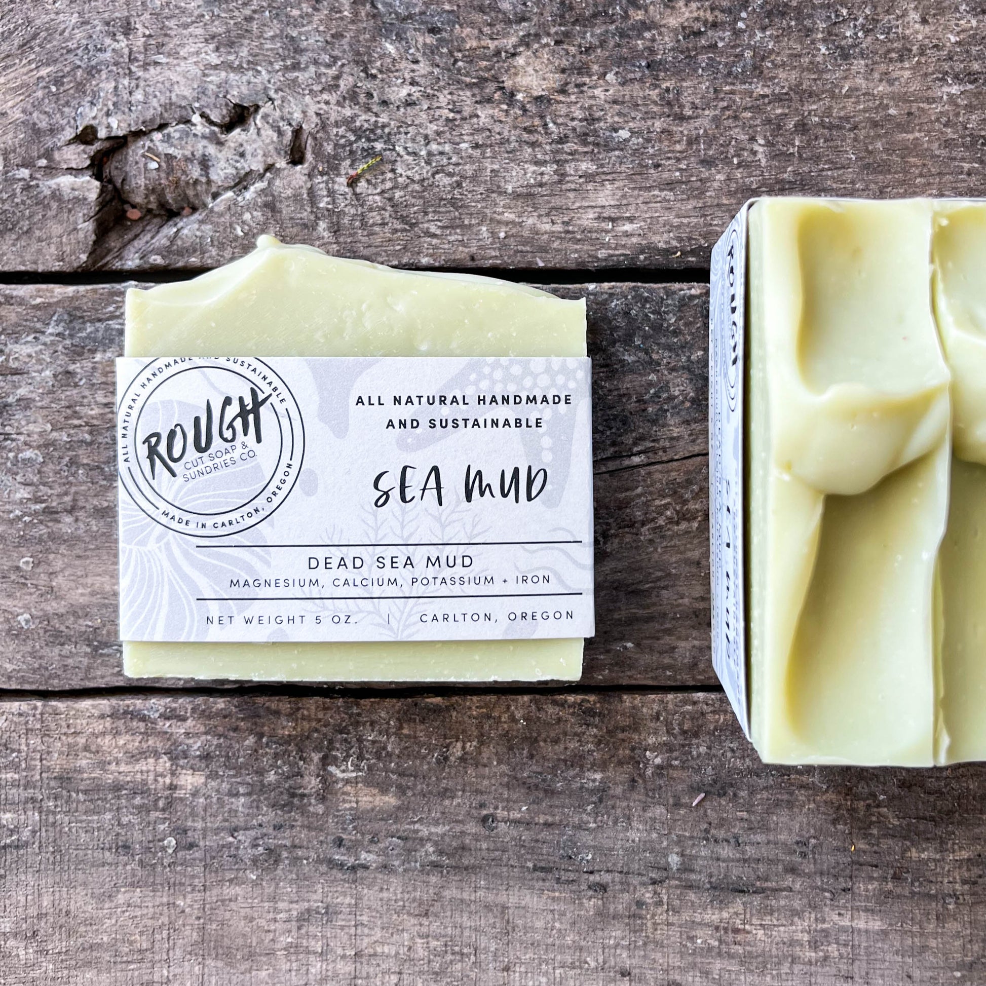 Bar of soap with packaging on a wooden surface